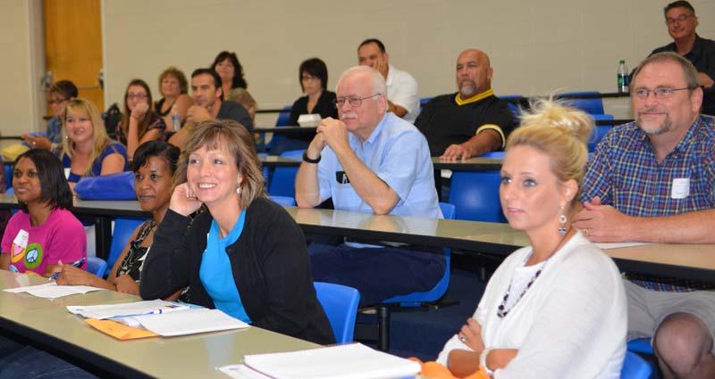 Attendees of the Dalton State Family Experience sitting in a tiered classroom, listening